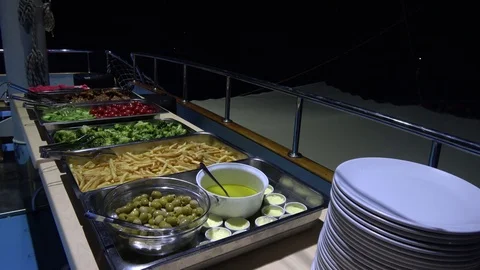 Plates and Buffet dinner set onboard at the sea Stock Footage 112602733