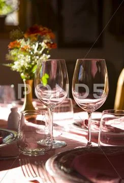 Plates and dishes lying on the table Stock Photos
