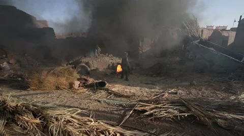 Plates and pots made of clay being burned in Tamegroute Stock Footage 49678538