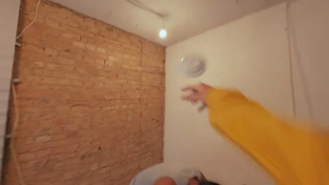 Plates are thrown at the man, which break against the wall. Video stock 317973495