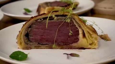 Plates with beef wellington Stock Footage 79508161