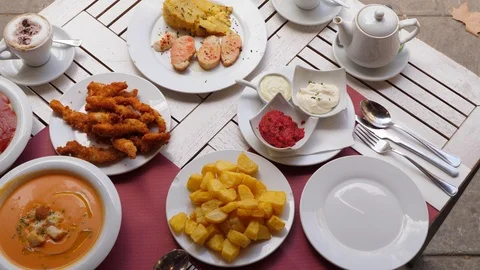 Plates with different tapas on the table, top view of typical snacks for dinner 스톡 동영상 102283749