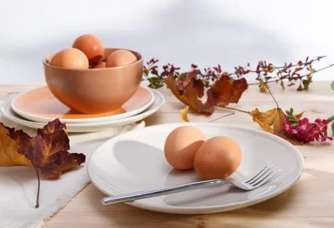 Plates with eggs Stock Photos