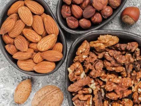 Plates with nuts close up 스톡 사진