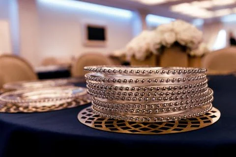 Plates in piles. wedding table decoration close-up. blue tablecloth 스톡 사진