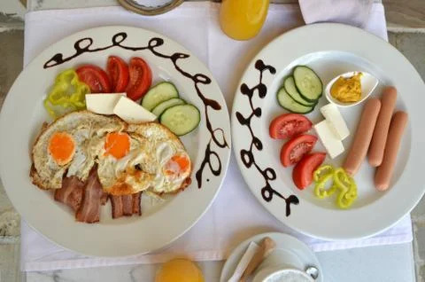 Plates with served breakfast Stock Photos
