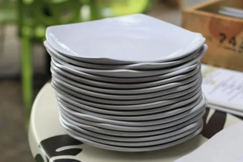 Plates stacked in odd way Stock Photos