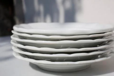 Plates on table Stock Photos