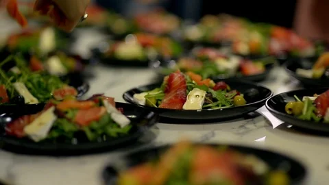 Plates on the table with salmon salad. Stock Footage 107438879