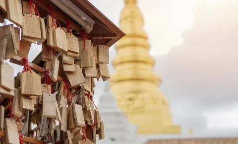 Plates that tourists often write to ask for blessings with blurred of A lar.. Stock Photos