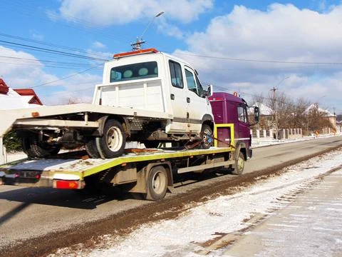Platform car on the road in winter Stock Photos