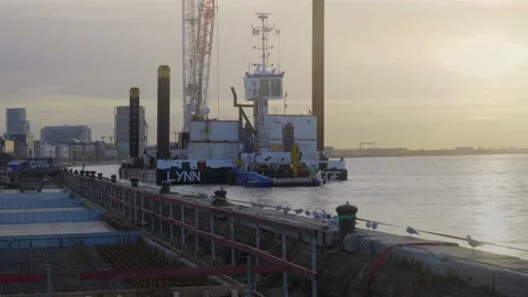 Platform crane boat working on renovation of old jetty piers Stockbeeldmateriaal 222073963