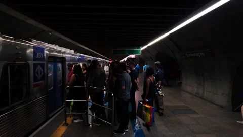With the platform crowded with people, passengers board a subway train Stock Footage 320371927