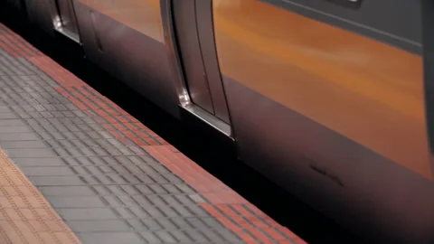Platform gap close up as commuter train depart station. May cause serious hazard Stock-Footage 219374403