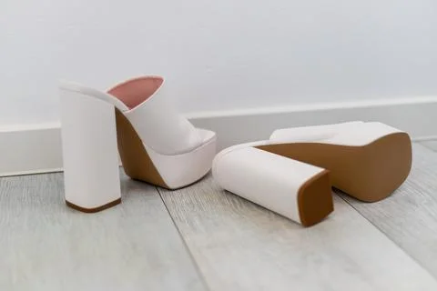 Platform high heels on a tapped in white with block heel as mules Stock Photos