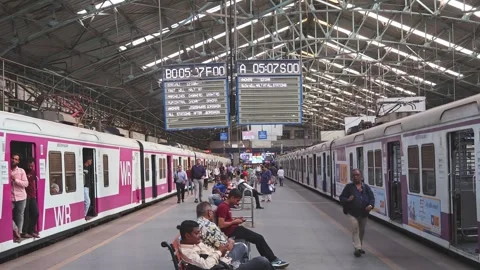 Platform with passengers and trains at Chhatrapati Shivaji Maharaj Terminus Stock Footage 301633708