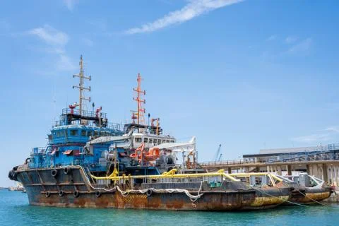 Platform supply vessel. Rusty ferry boats with cranes Stock Photos