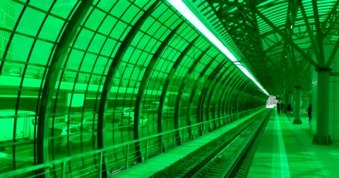 Platform of the train, behind the green glass wall, the traffic on the motorway Stock Footage 67468507