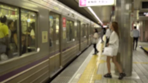 Platform View of Japanese Subway Train Arriving and Anonymous People Entering Stock Footage 269156292