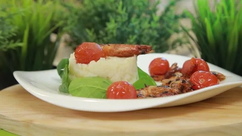 Plating and presentation of celery root puree with fried shrimp and cherry tomat Stock Footage 340552227
