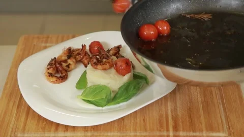 Plating and presentation of celery root puree with fried shrimp and cherry tomat Stock Footage 340552231