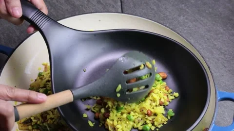 Plating Batata and Kanda Poha or Potato, Onion Poha, a Maharashtrian snack dish. Stock Footage 147107175