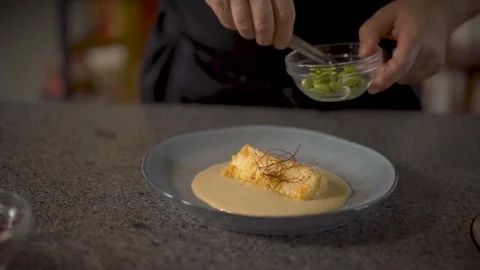 Plating cod recipe with almond and pea sauce Stock Footage 278235410