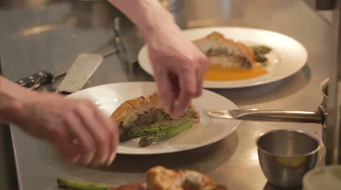 Plating up fish dish by restaurant chef Stock Footage 58431730
