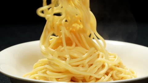 Plating Fresh Cooked Spaghetti on White Plate Stock Footage 345774122