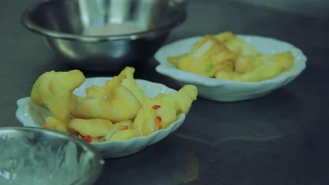 Plating up fried calamari in Chinese kitchen Stock Footage 78017851