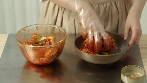 Plating Homemade Kimchi onto Dish Stock Footage 334705255