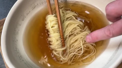 Plating Japanese Cold Ramen Placing Noodles Into Chilled Soup Chopsticks Japan Stock Footage 345708678