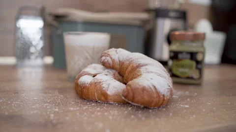 Plating Pistachio Croissants with a Dusting of Sugar Video stock 281861064