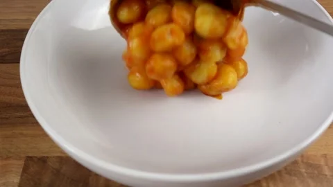 Plating Up Small Gnocchi Glazed In A Tomato Sauce 스톡 동영상 135419295