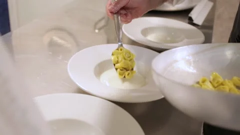 Plating tortellini in a restaurant kitchen Stock Footage 169370348