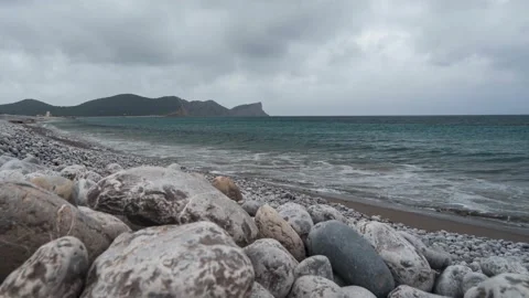 Platja des Codolar, beach in Ibiza, time lapse of waves and fast moving clouds Video stock 175862983