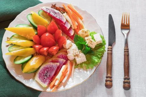 Platter of assorted fresh vegetables, hare top view, close-up Stock Photos