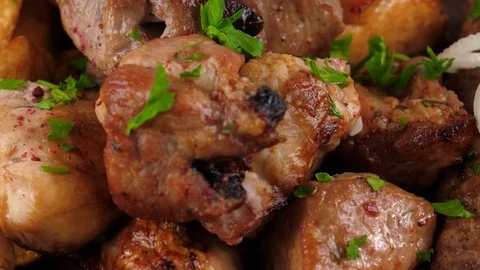 Platter of broiled meat on the grill or meat kebabs, close-up view 動画素材 83164719