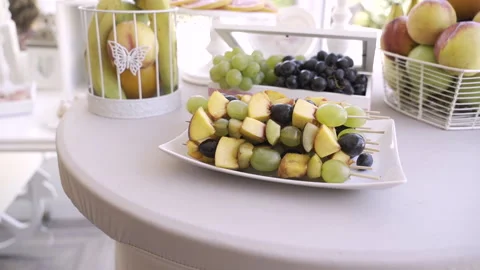 Platter of fruit skewers, placed on the fruit bar from a wedding Stock Footage 235863631