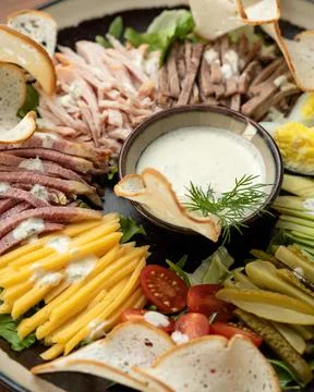 Platter with mix or assorted of meat, ham, cheese and vegetables cuts Stock Photos