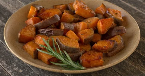 Platter of roasted sweet potatoes. Stock Footage 312610505