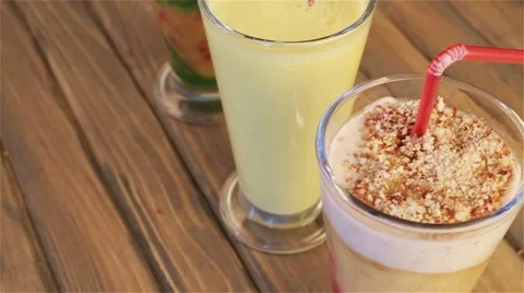 Platter of three different fruit smoothies smoothies for breakfast. Stock Footage 64306861