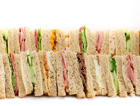 A platter of triangular sandwiches Foto stock