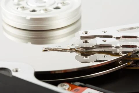 Platters and head of a computer hard drive Stock Photos