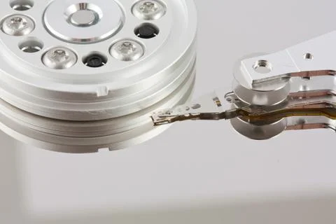 Platters and head of a computer hard drive Stock Photos