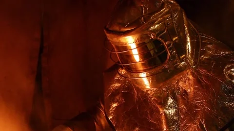Plav 4Workers in refractory suits, melt gold. Stock Footage 122211865