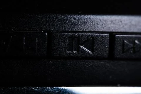 The play and pause icon button is close on the device. Old and dirty Stock Photos