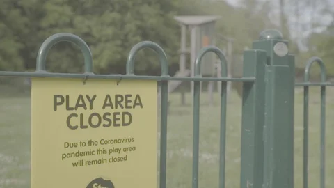 Play area closed sign because of Coronovirus Covid-19 Pandemic Stock Footage 129894069