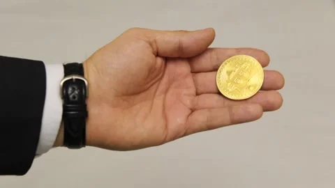 Play with bitcoin in hand Stock Footage 103841587