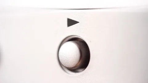 Play button on metallic device. Macro focus Video stock 88245075